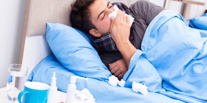 A sick man in bed