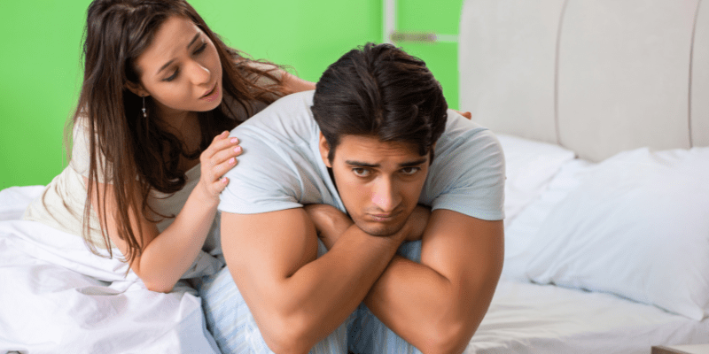 A man and woman in bed