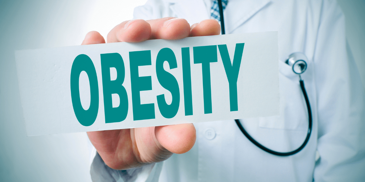 A doctor holding the word obesity