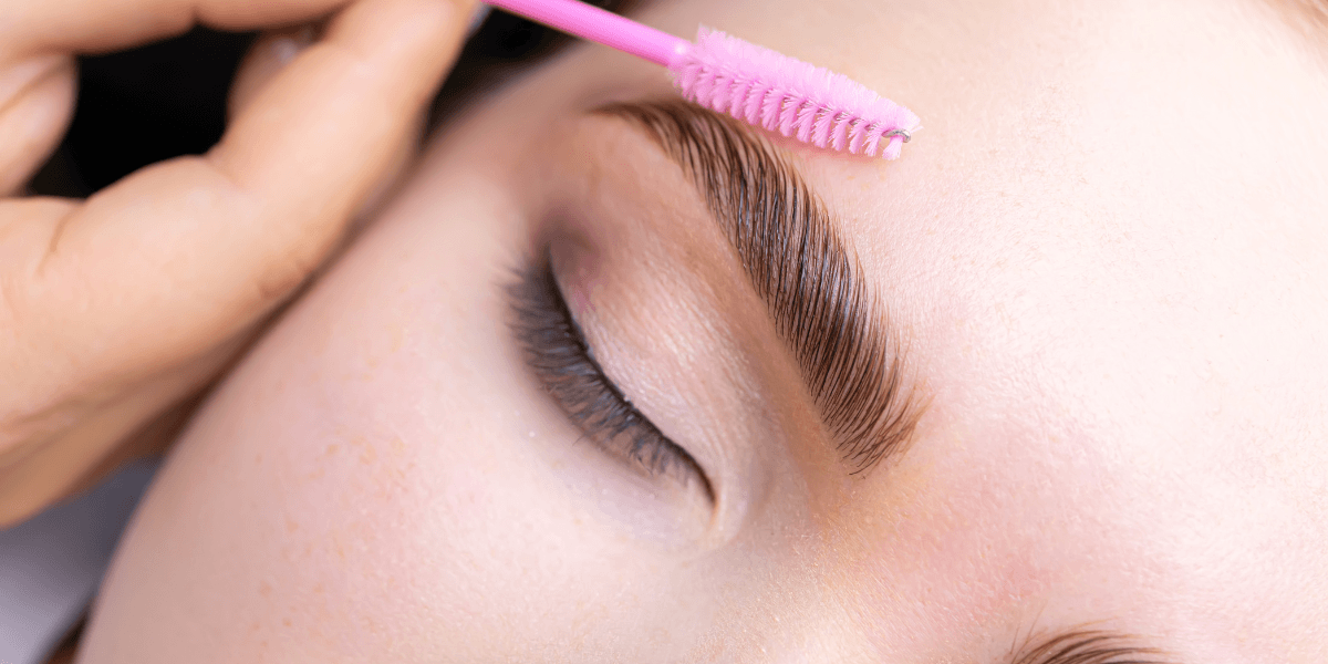 Close up of grooming a woman's eyebrow