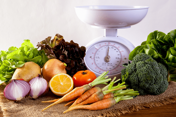 nutritious foods and a scale