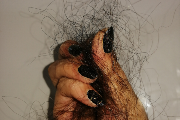 woman holding hair