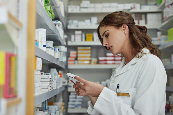 pharmacist looking at a semaglutide dosage