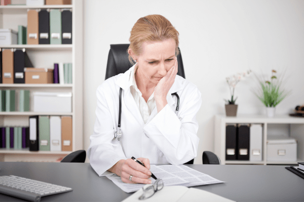 A serious-looking woman doctor