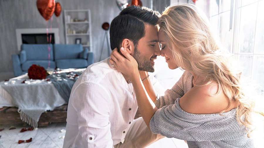 Couple embracing, facing each other