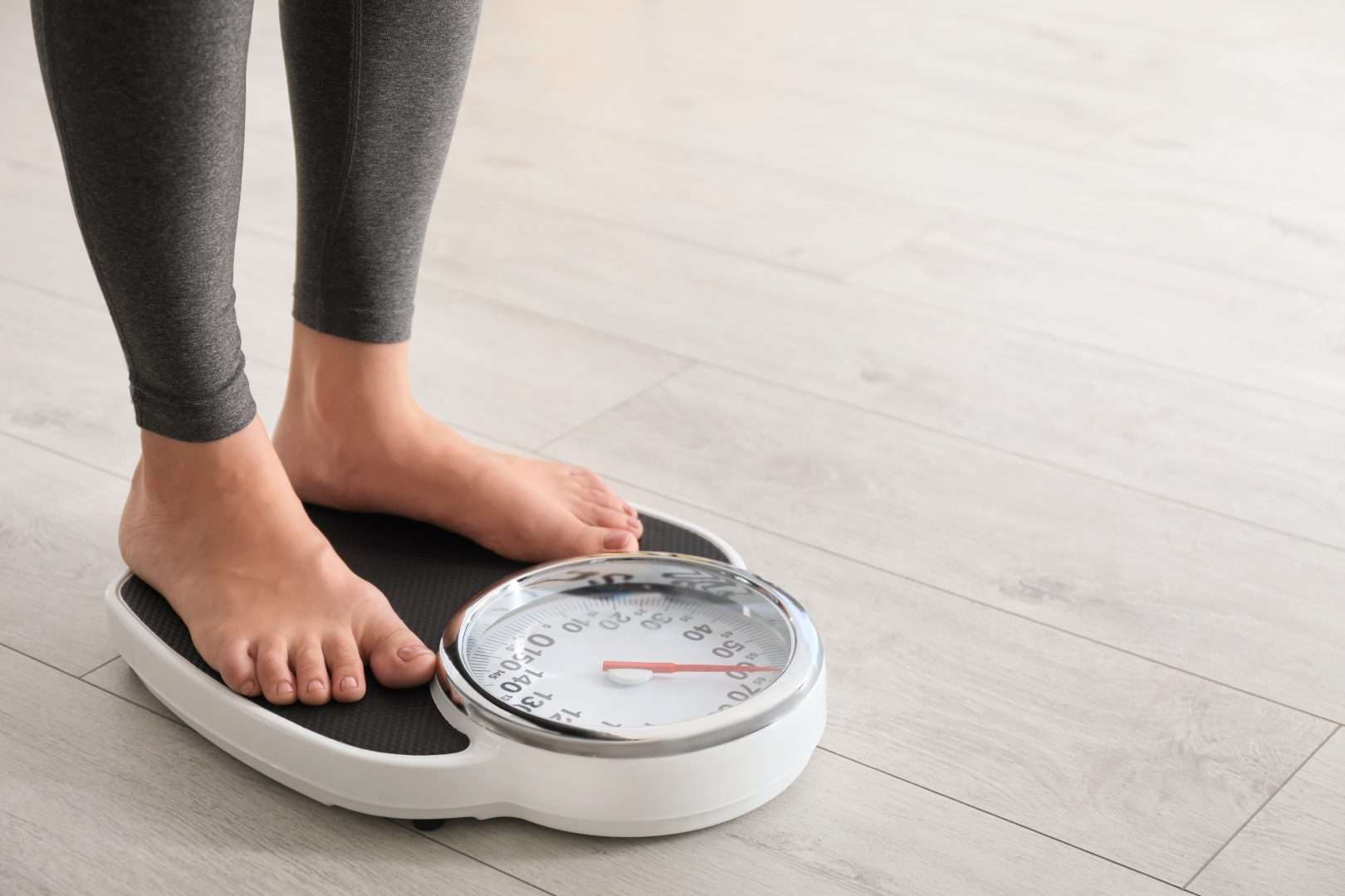 Woman standing on a scale