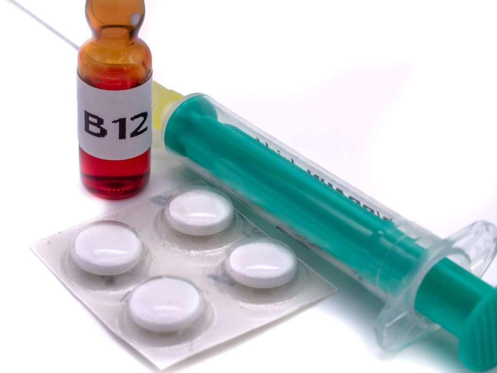 A vial of B12 and a syringe