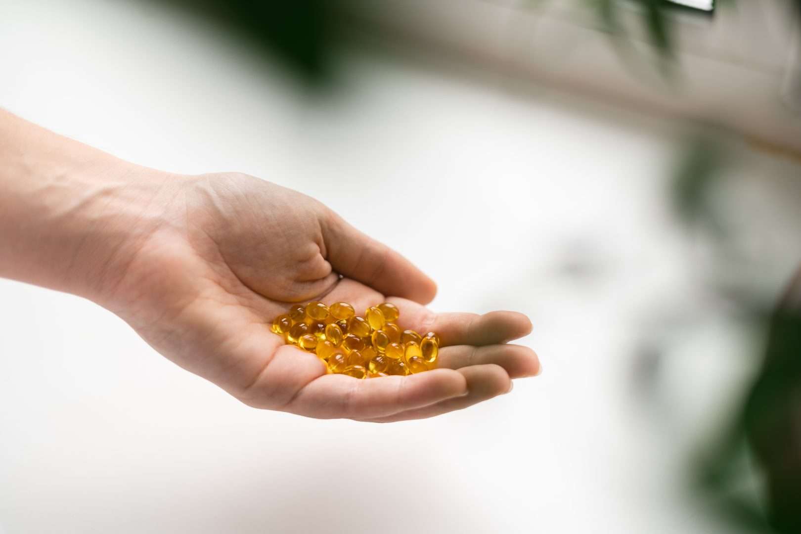 Close up of hand full of Vitamin B12 pills